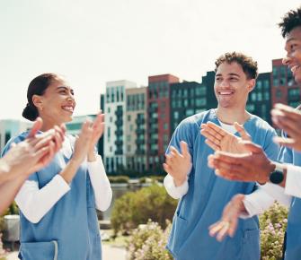 Group of nurses clapping 