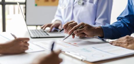 Doctor at desk with patient