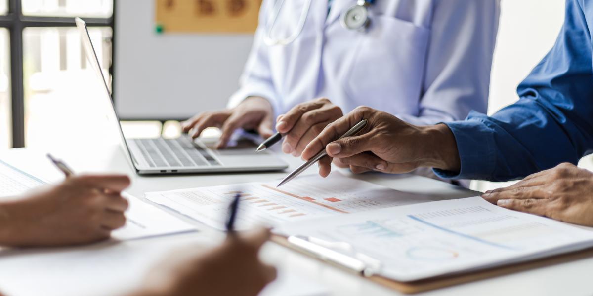 Doctor at desk with patient